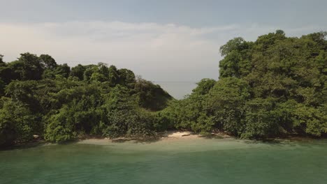 drone-dolly-tilt-down-shot-small-deserted-tropical-island