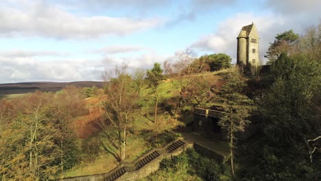 Fairy-tale-Rivington-historic-English-terraced-gardens-landmark-remains-aerial-pull-away-to-wide-view-at-Winter-hill