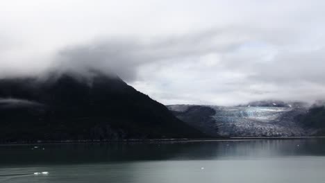 Glacier-and-mountain-with-cloud-on-top,-in-Glacier-Bay-National-Park,Alaska