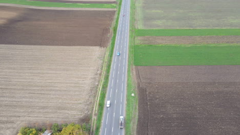 Hyperlapse-Cars-Drive-rural-countryside-road-surrounded-by-agricultural-fields