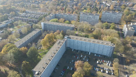 High-aerial-of-social-housing-flats-and-apartment-buildings-in-small-rural-town-in-autumn
