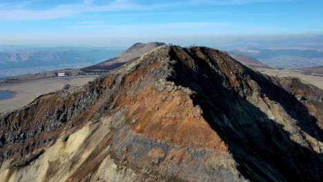 Wide-drone-shot-of-mountain-range-near-the-volcano-Mount-Aso