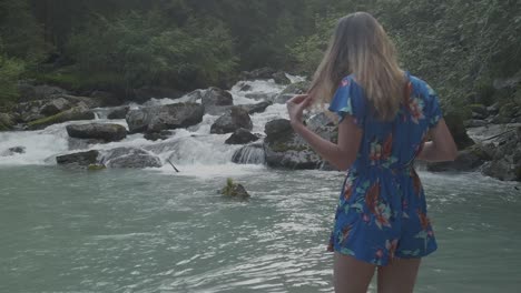 View-from-behind-of-a-skinny-blonde-girl-entering-the-water