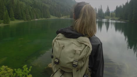 Sport-holiday-maker-woman-go-hiking-near-a-green-lake