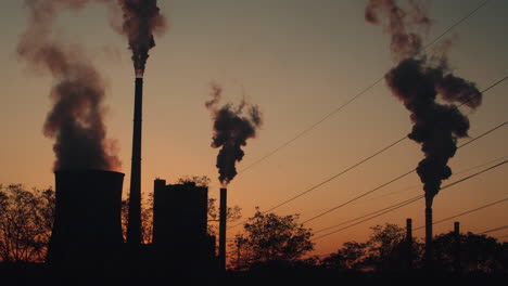 Timelapse-of-power-plant-with-smoking-chimneys-at-sunset-in-Melnik,-Czech-Republic