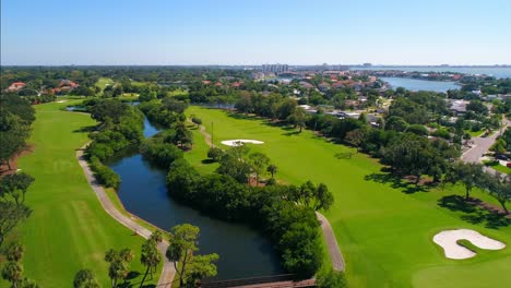 Flying-over-a-opulent-resort-style-golfing-community-in-St