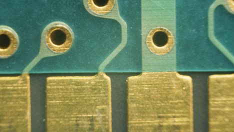 PCB-circuit-board-soldering-gold-plated-contacts-connections-under-microscope