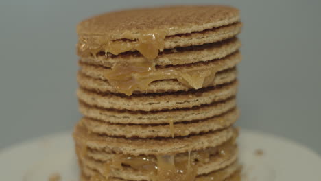 Tilt-up-over-delicious-stack-of-stroopwafels,-a-typical-dutch-cookie
