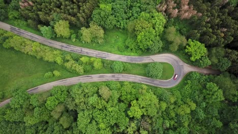 Directly-above-view-of-car-driving-on-winding-road