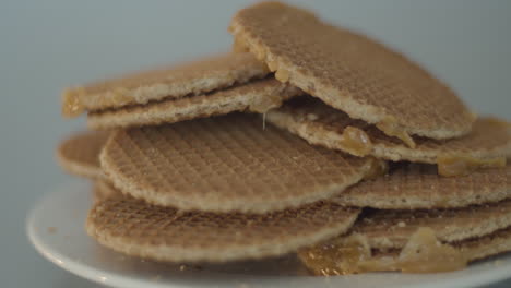 Pile-on-stroopwafels-lying-on-a-white-plate---dolly-in