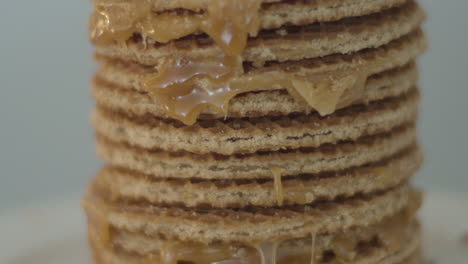 Tilt-up-of-delicious-stack-of-stroopwafels,-a-typical-dutch-cookie---extreme-close