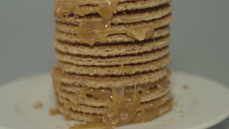 Tilt-down-of-delicious-stack-of-stroopwafels,-a-typical-dutch-cookie
