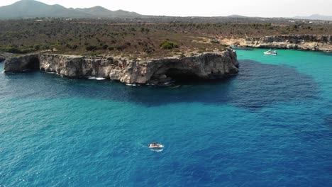 Aerial-of-pleasure-boat-in-Mediterranean-Sea-off-coast-of-Mallorca