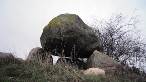 Ancient-dolmen-stone-megalithic-site-in-Brandenburg-Germany,-arc-shot