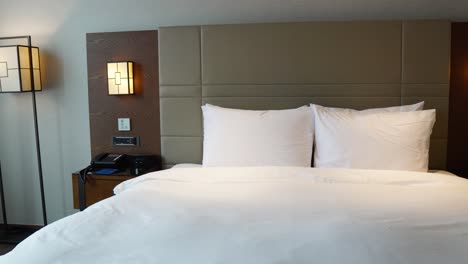 Double-cozy-made-up-bed-in-Traditional-Korean-Hotel-in-Seoul,-South-Korea
