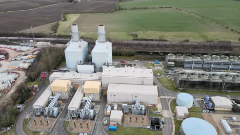 Little-Barford-Power-Station-St-Neots-UK-train-passing-in-background-Aerial-footage-4K