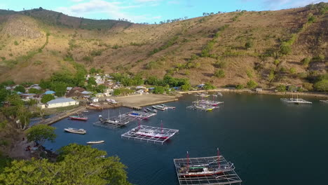 aerial-view-of-bay-Bima,-Indonesia-West-Nusa-Tenggara,-fisherman-boat-and-little-rural-village-in-remote-area