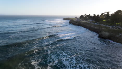 Aerial-view-of-Santa-Cruz-Beach-California-with-Lighthouse-Point-and-surfers-shot-in-4k-high-resolution