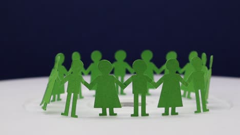 Paper-cut-of-children-holding-to-each-other-for-making-a-circular-dance