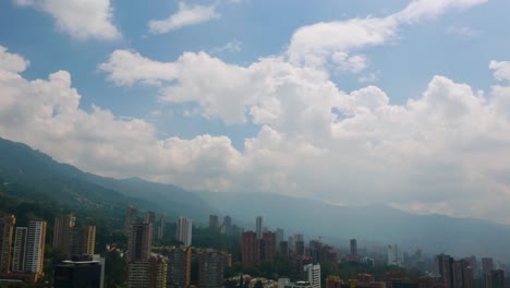 Backwards-Flight---Drone-Flies-Away-from-Apartment-Buildings-in-Medellin,-Colombia