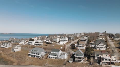 Aerial-left-to-right-shot-of-a-residential-area-in-Cohasset-4K
