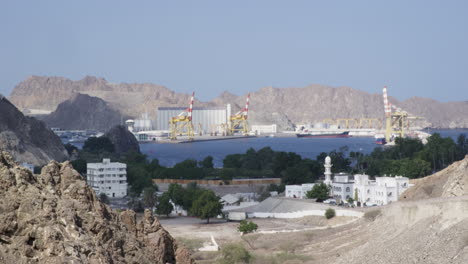Port-Sultan-Qaboos-as-seen-from-the-hills,-Muscat,-Oman,-wide-shot