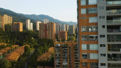 Drone-Flies-Over-Apartment-Buildings-in-El-Poblado,-Medellin
