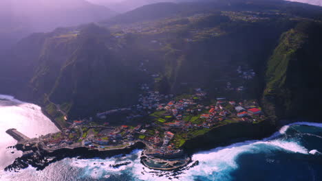 Cinematic-aerial-view-of-Poto-Moniz-with-beautiful-mountain-landscape-and-city-in-the-valley