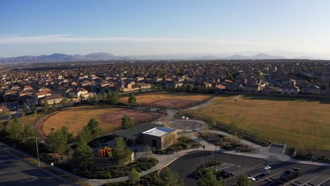 Wide-aerial-shot-flying-over-recreation-center-and-athletic-fields-in-a-master-planned-development-in-the-desert