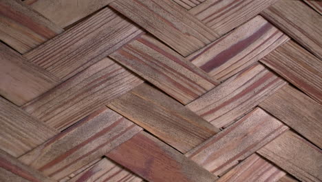 Close-up-of-woven-hinoki-wood-strips-on-the-wall-of-a-Japanese-bathhouse