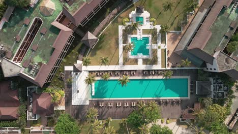 Drone-descending-view-of-a-empty-swimming-pool-birds-eye-view