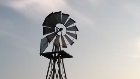 A-small-windmill-turning-in-the-light-of-the-evening-sun-and-breeze