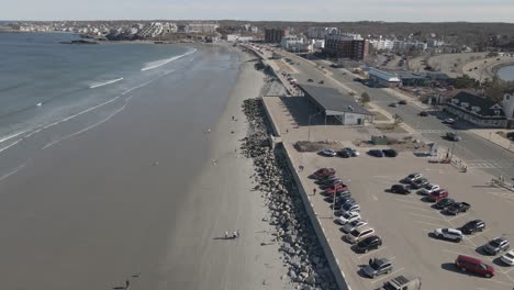 Aerial-slow-motion-of-Nantasket-Beach,-Hull,-MA-Showing-Bandstand-Pavilion-on-the-right-of-clip
