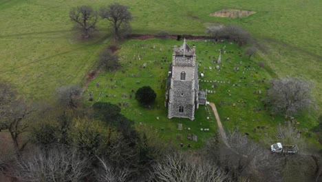 Aerial---St-Mary's-Church-in-Somerleyton,-England,-wide-shot-forward-overhead