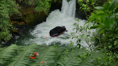 Group-of-rafting-people-in-boat-having-accident-after-falling-down-the-high-Tutea-Falls