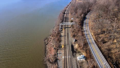 Aerial-drone-footage-of-the-Amtrak-Hudson-Line-in-the-Hudson-Valley-in-New-York-during-early-spring