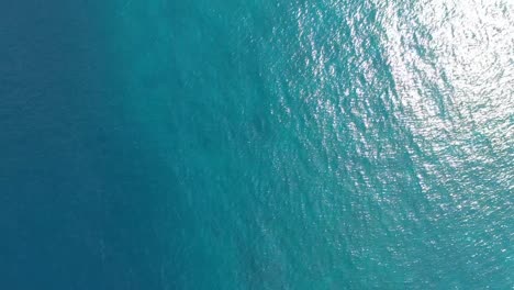 Aerial-top-down-view-from-high-altitude-of-blue-azure-turquoise-sea-water-texture