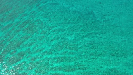 Aerial-top-down-view-from-high-altitude-of-blue-turquoise-sea-water-texture