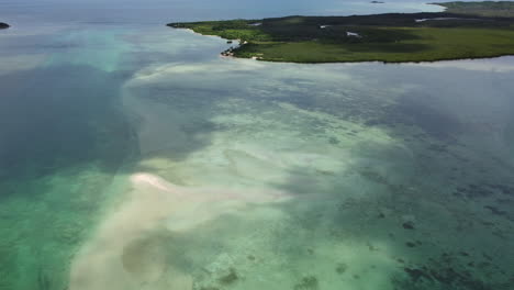 Flyover-above-Boat-Pass,-remote-northern-point-of-New-Caledonia-main-island