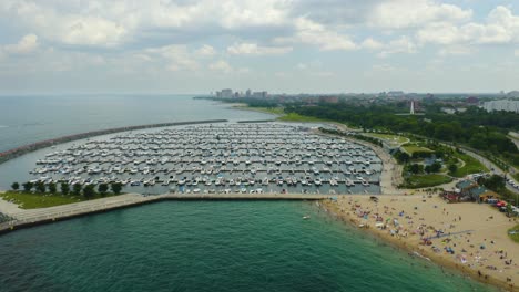 Fixed-Aerial-View-of-31st-Street-Harbor-and-31st-Street-Beach-on-Crowded-Summer-Day