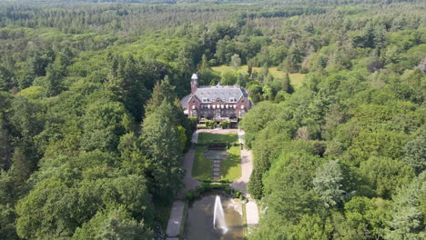 Flying-towards-beautiful-mansion-in-the-middle-of-forest