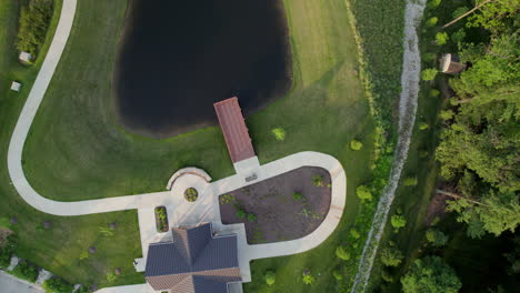 Top-down-view-of-a-pretty-park-with-a-nice-pond-in-Town-and-Country-in-St