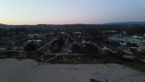 Aerial-view-of-Santa-Cruz-California-over-the-sand-at-sunset-shot-in-4k-high-resolution