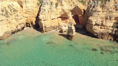 Cliffs-and-caves-of-pristine-Atlantic-Ocean-coast,-Lagos,-Algarve,-Portugal