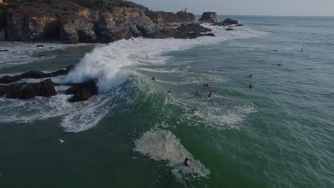 Waves-crashing-through-surfers-waiting-for-the-perfect-opportunity-in-Punta-Zicatela