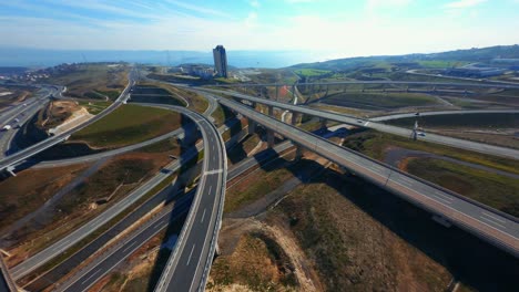 FPV-sports-drone-flight-of-Highway-showing-multiple-Roads,-Bridges,-Viaducts-with-little-car-traffic