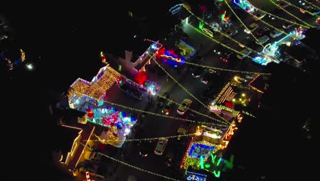 Christmas-lights-over-Valencia-neighborhood-street,-night-cityscape-aerial-view