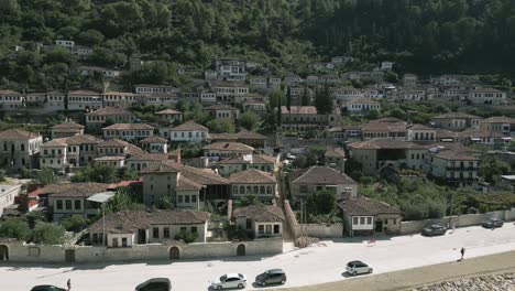 Aerial-shot-of-Gorica,-ancient-part-of-Berat-with-large-window-buildings