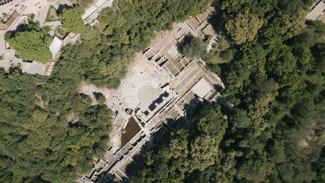 Top-down-aerial-shot-of-ancient-Theatre-in-Butrint-archeological-site