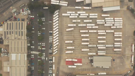Bus-depot-tracking-shot-as-one-vehicle-moves-into-position